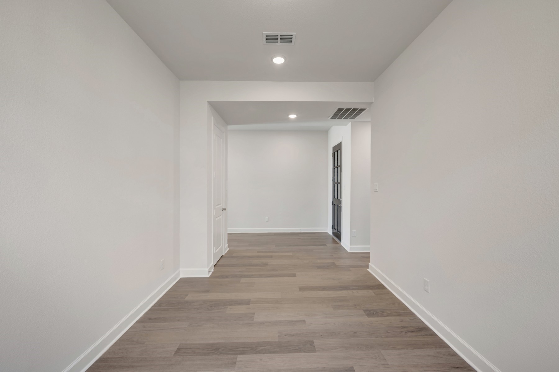 646 Walnut Br Drive Rosenberg, TX 77471 - Photo 15 of 46 a view of a hallway with wooden floor