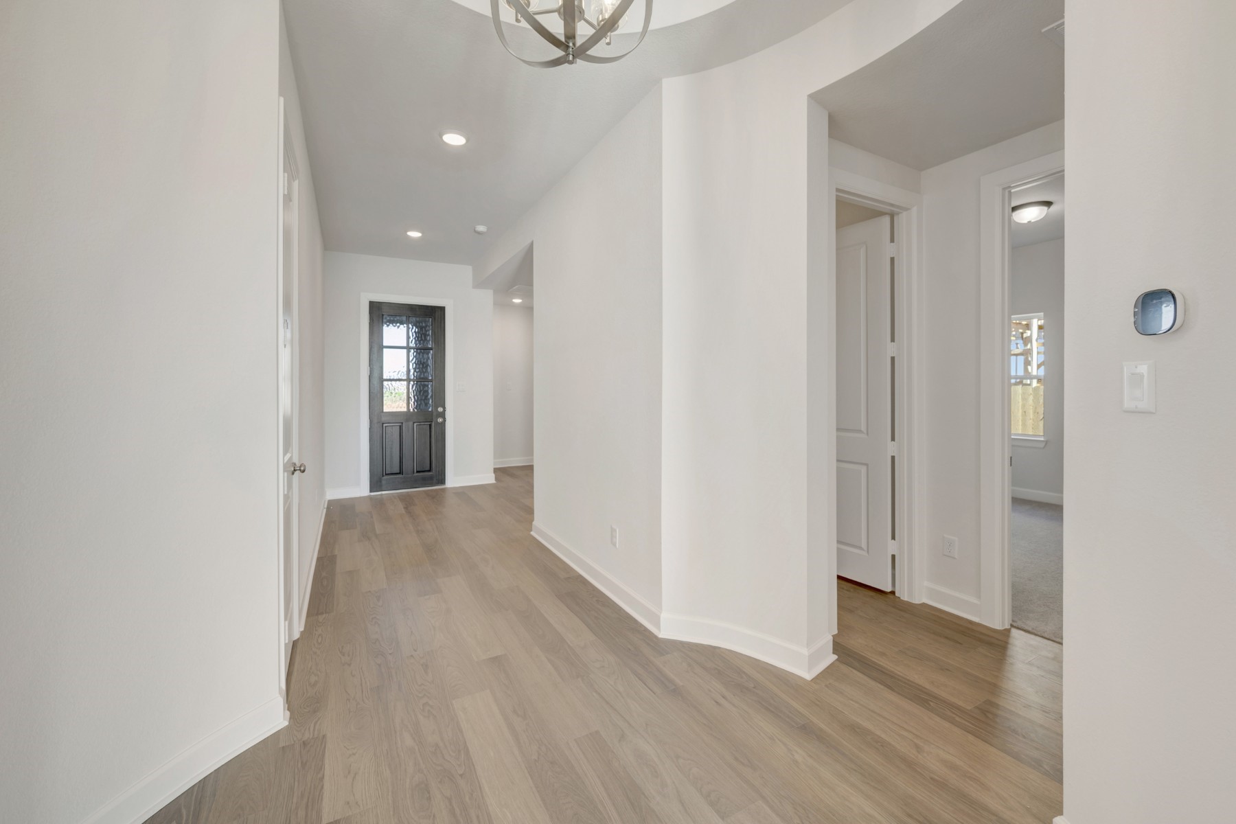 646 Walnut Br Drive Rosenberg, TX 77471 - Photo 19 of 46 a view of a hallway with wooden floor