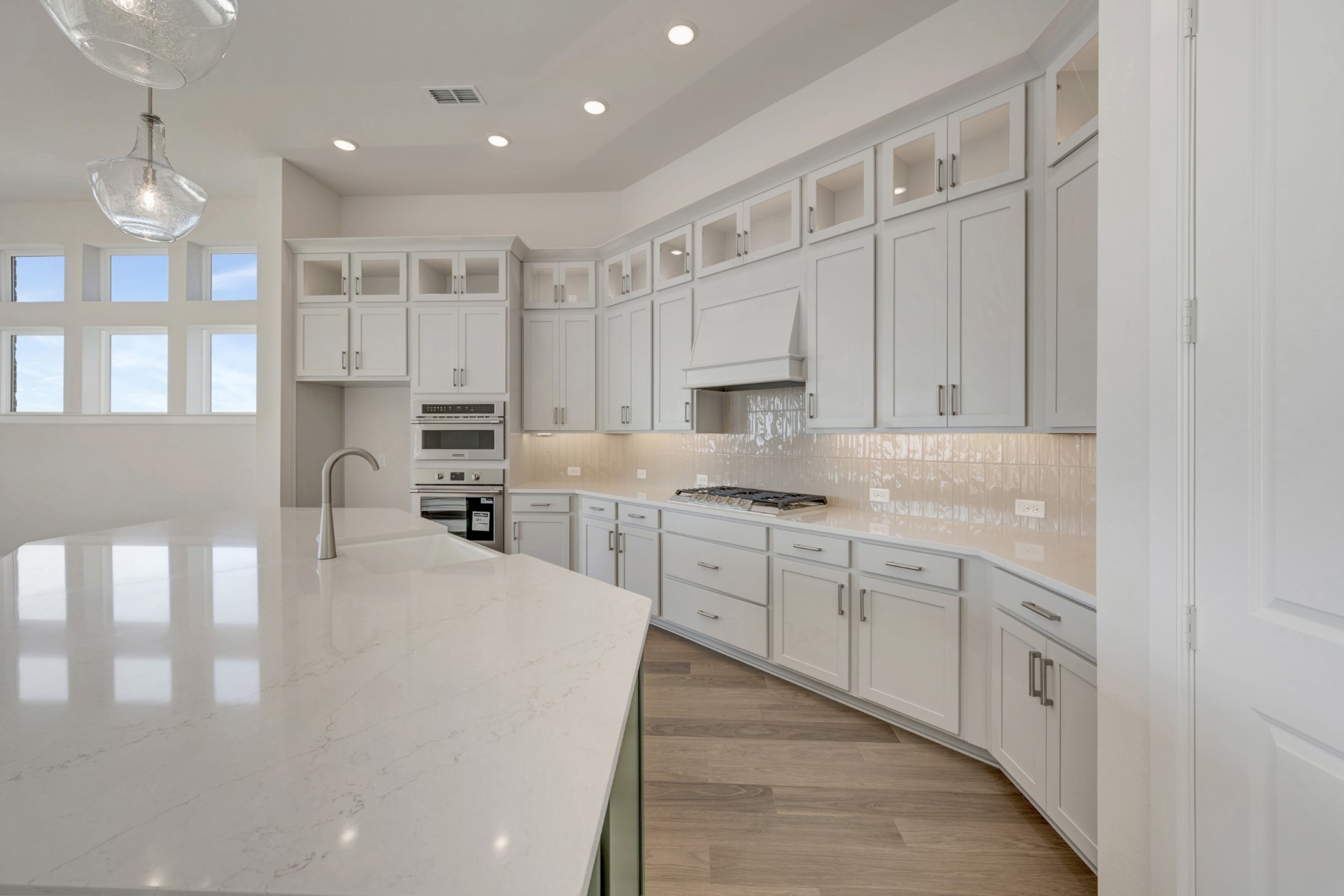 646 Walnut Br Drive Rosenberg, TX 77471 - Photo 28 of 46 a kitchen with granite countertop white cabinets and white appliances