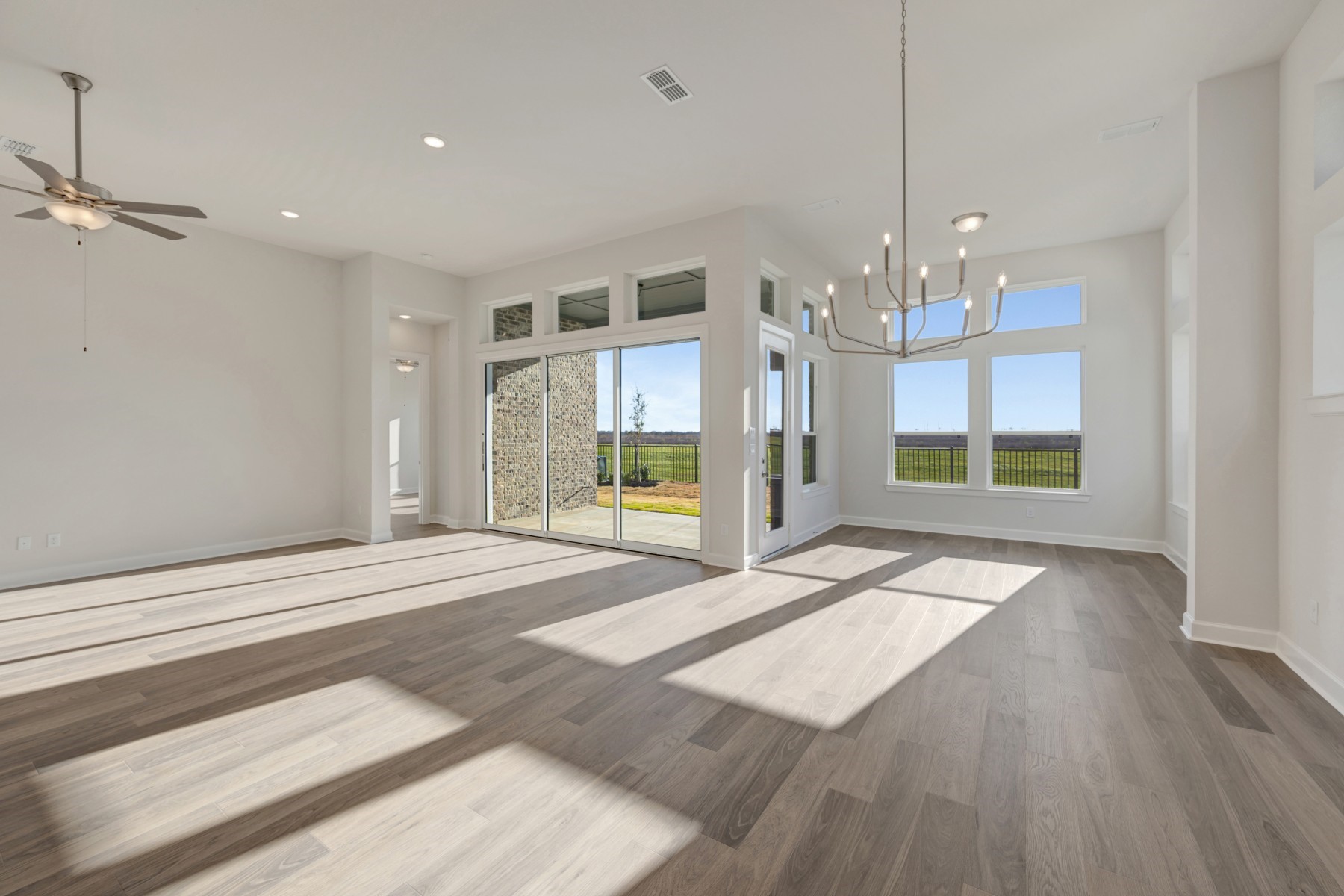 646 Walnut Br Drive Rosenberg, TX 77471 - Photo 30 of 46 a view of an empty room with wooden floor and a window