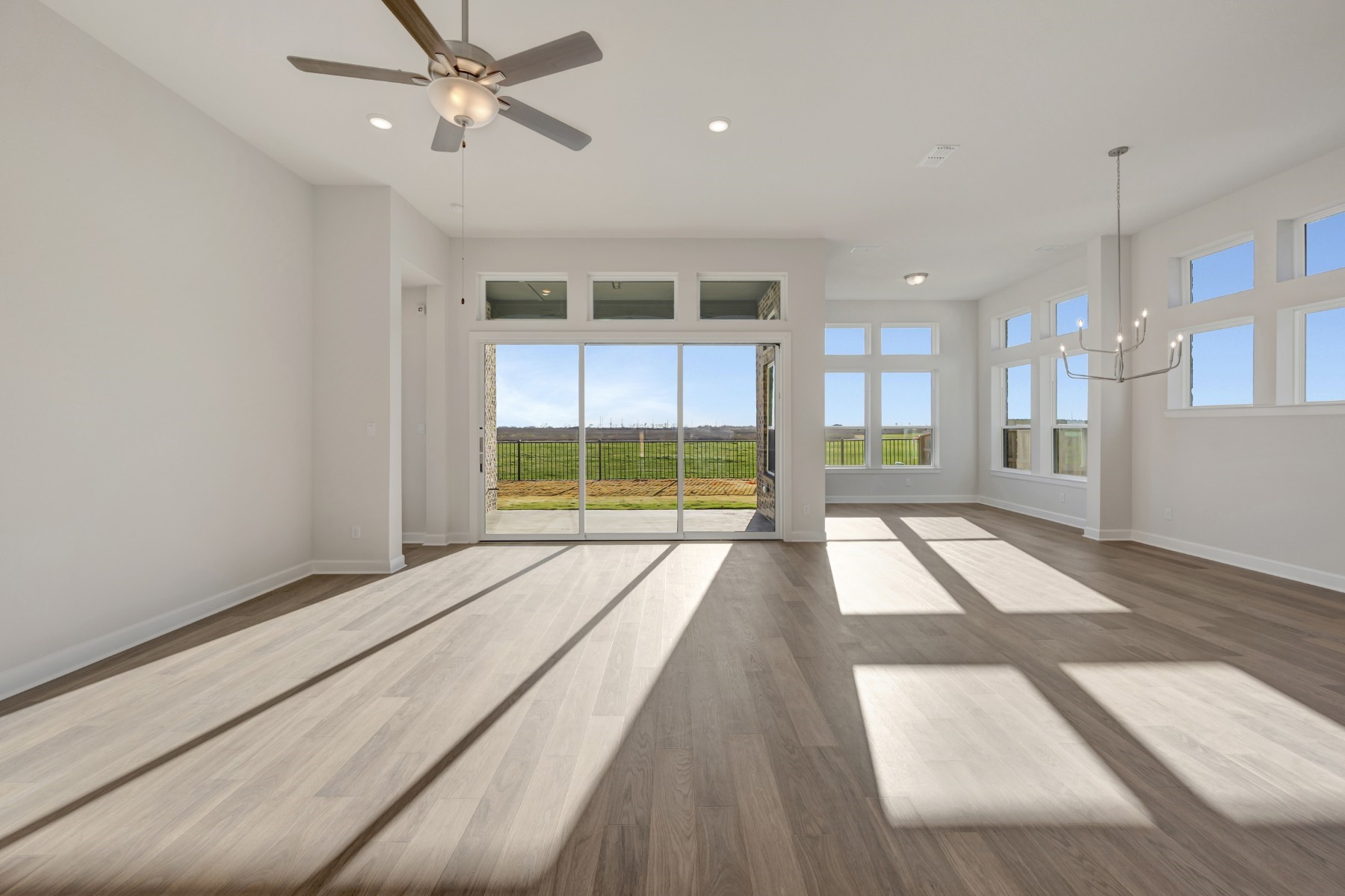 646 Walnut Br Drive Rosenberg, TX 77471 - Photo 35 of 46 a view of an empty room with a window and wooden floor
