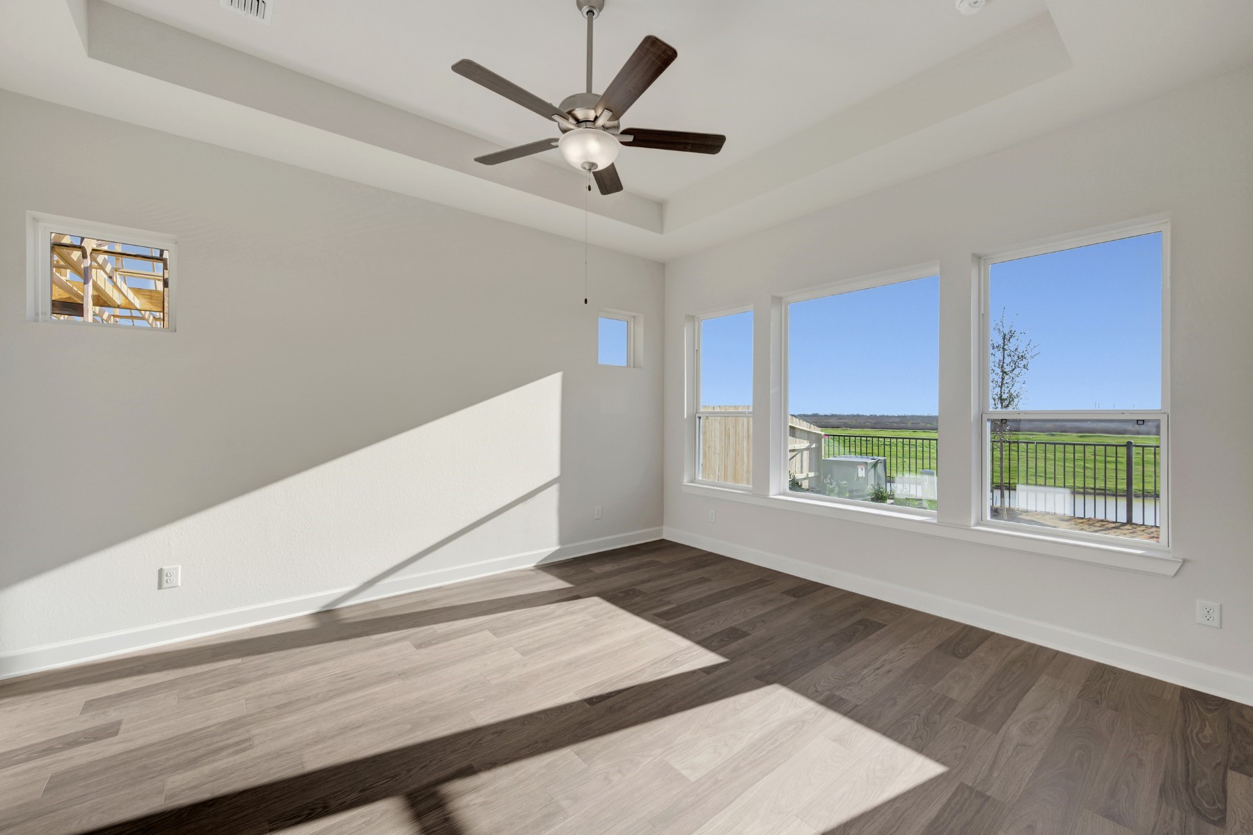 646 Walnut Br Drive Rosenberg, TX 77471 - Photo 38 of 46 a view of an empty room with a window and a ceiling fan