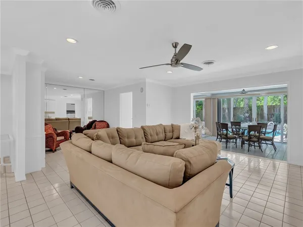 a living room with furniture and white walls