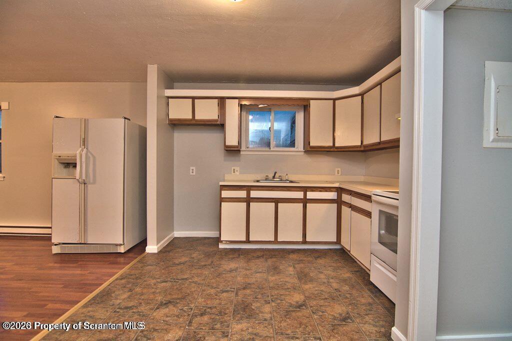1418 North Main Avenue Scranton, PA 18508 - Photo 12 of 26 a kitchen with stainless steel appliances granite countertop a stove a sink and a refrigerator
