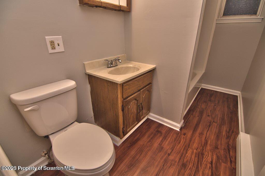 1418 North Main Avenue Scranton, PA 18508 - Photo 16 of 26 a white toilet sitting next to a bathroom sink