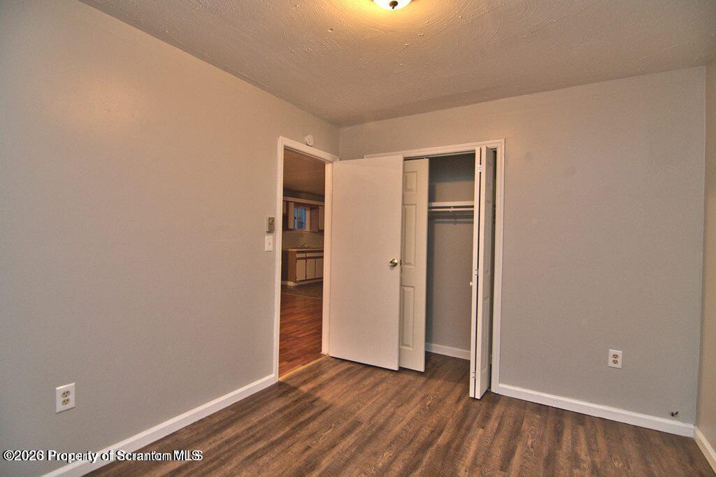 1418 North Main Avenue Scranton, PA 18508 - Photo 25 of 26 an empty room with wooden floor and closet