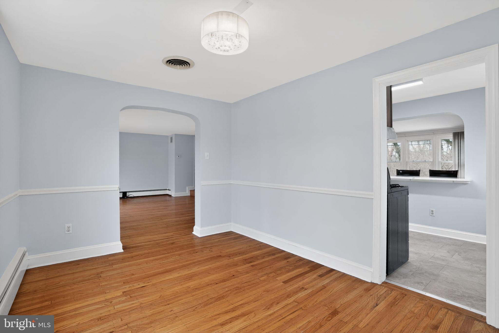 616 Hey Lane Springfield, PA 19064 - Photo 12 of 35 wooden floor in an empty room with a window