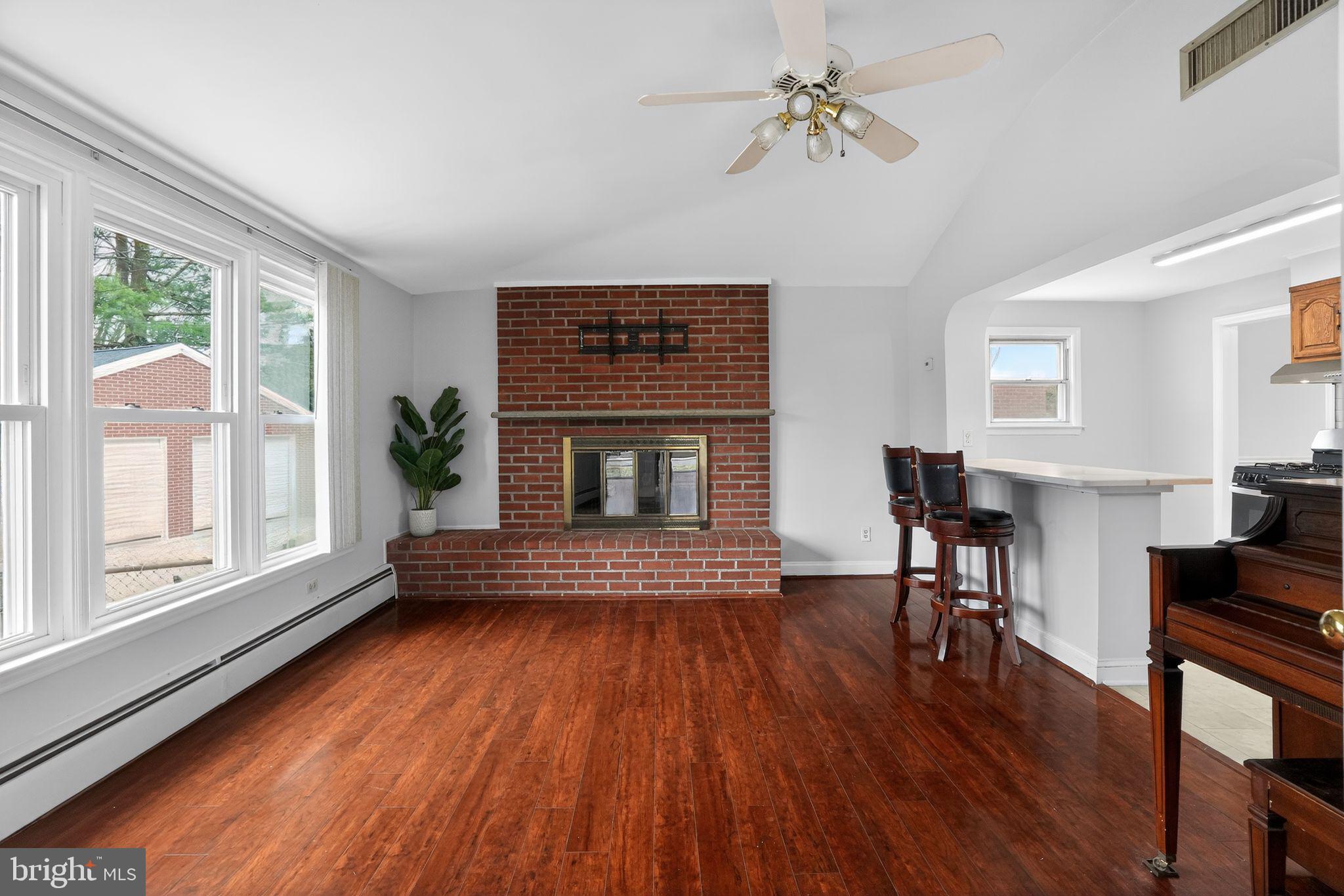 616 Hey Lane Springfield, PA 19064 - Photo 15 of 35 a living room with furniture and a fireplace