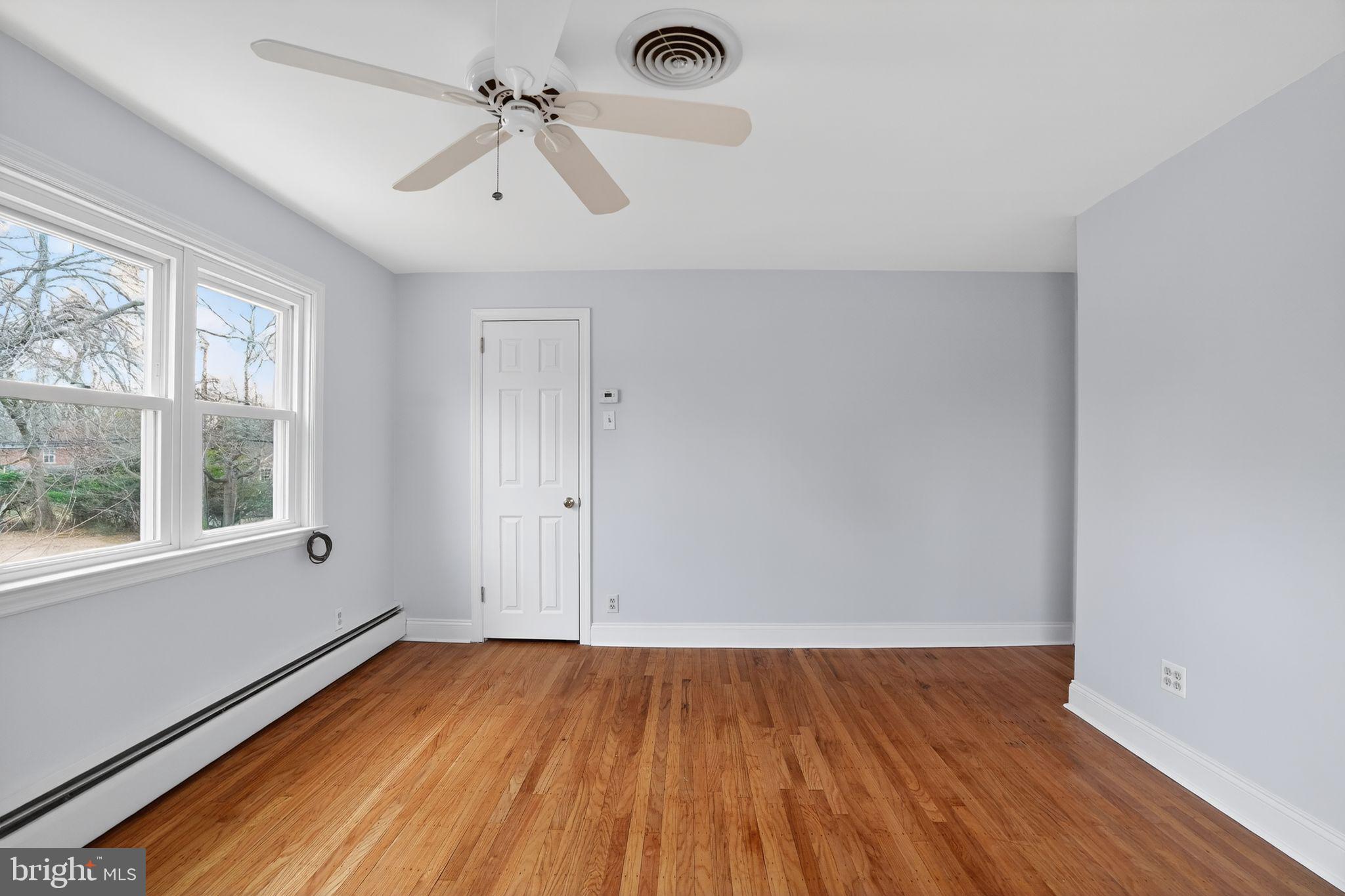 616 Hey Lane Springfield, PA 19064 - Photo 18 of 35 wooden floor in an empty room with a window
