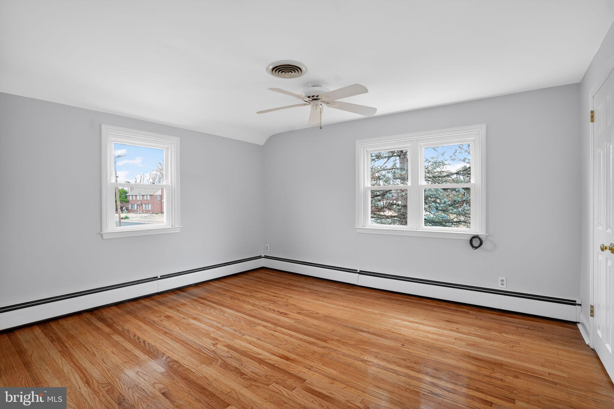 616 Hey Lane Springfield, PA 19064 - Photo 19 of 35 wooden floor in an empty room with a window