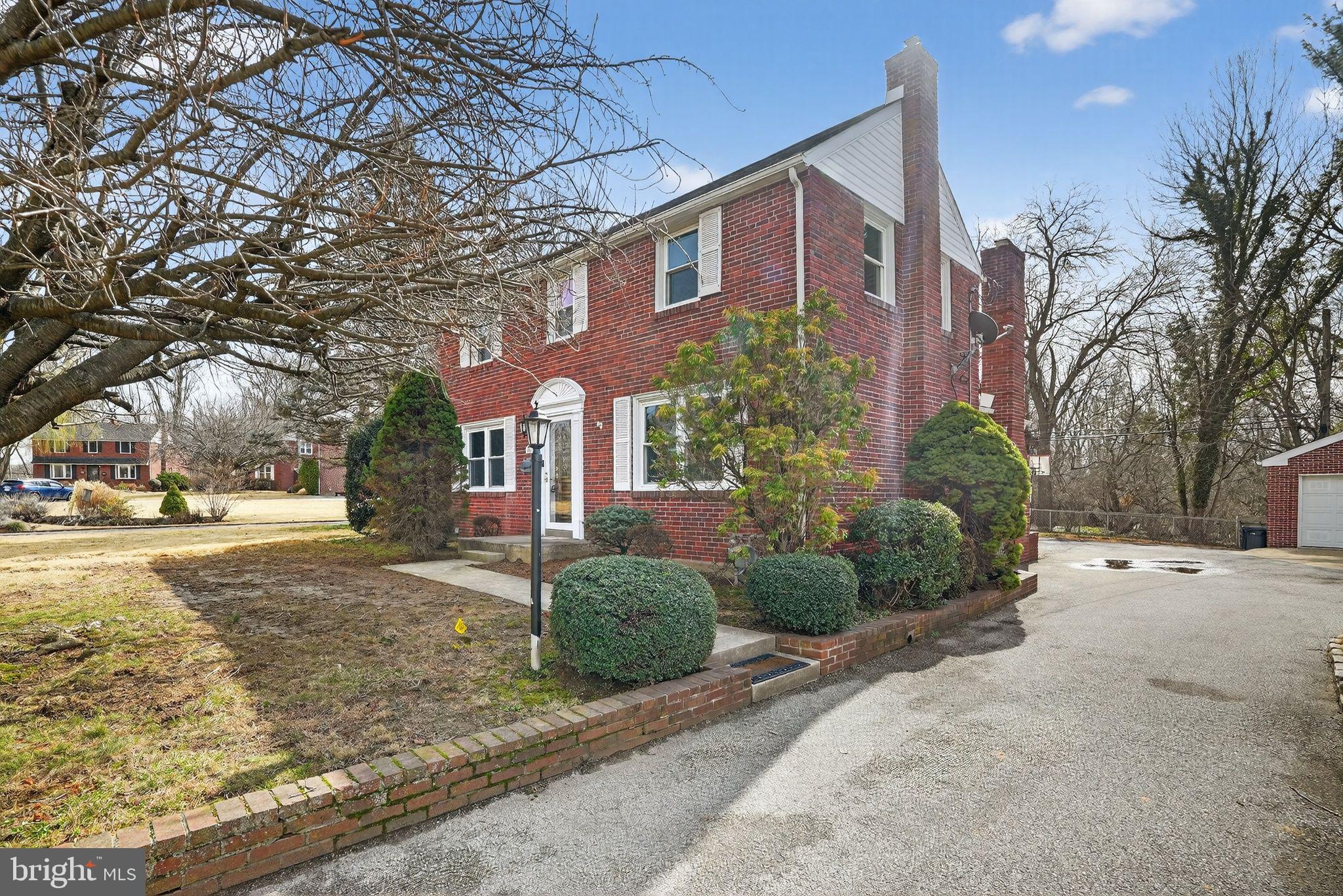 616 Hey Lane Springfield, PA 19064 - Photo 2 of 35 a front view of a house with a yard and garage