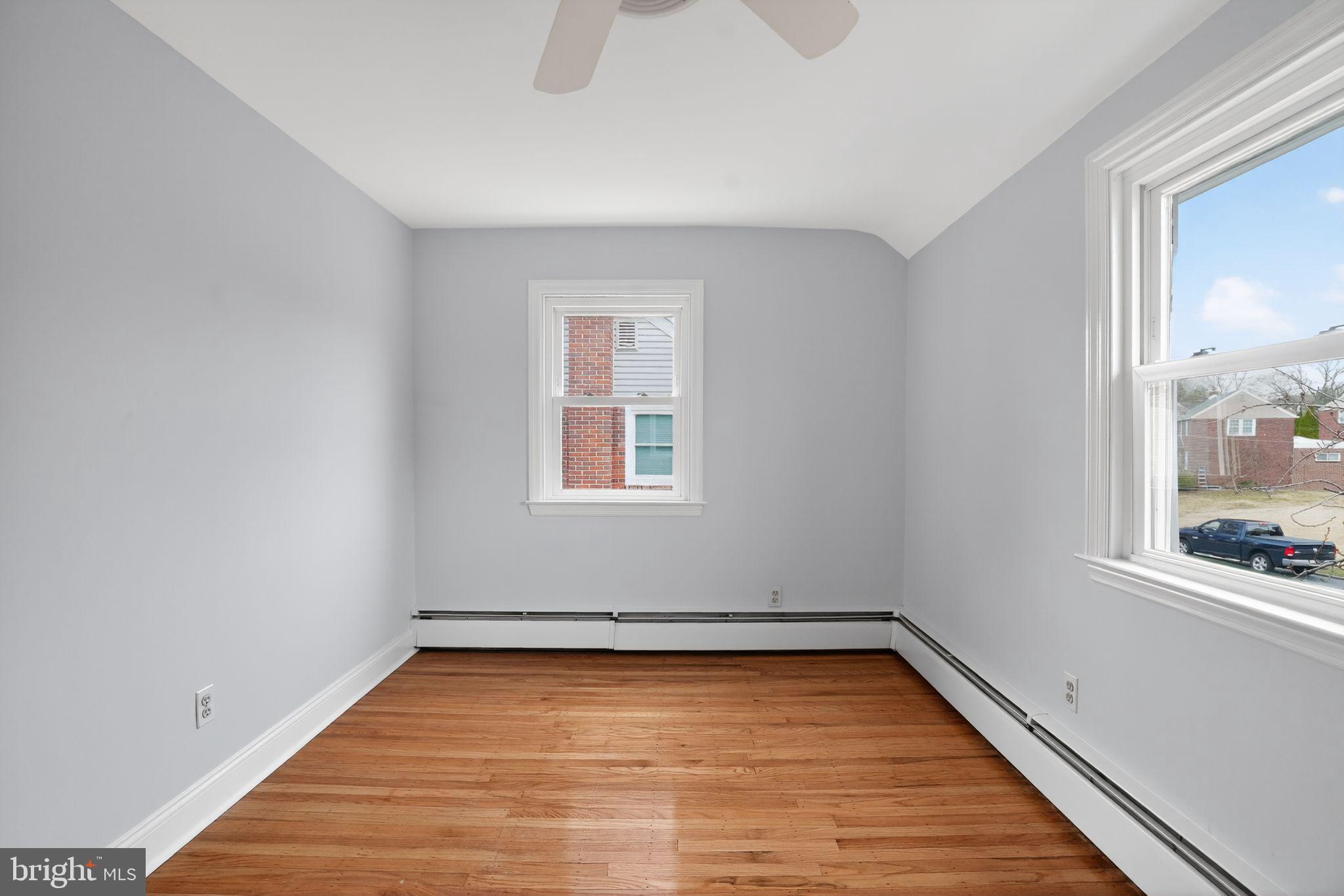 616 Hey Lane Springfield, PA 19064 - Photo 22 of 35 a view of an empty room with wooden floor and a window