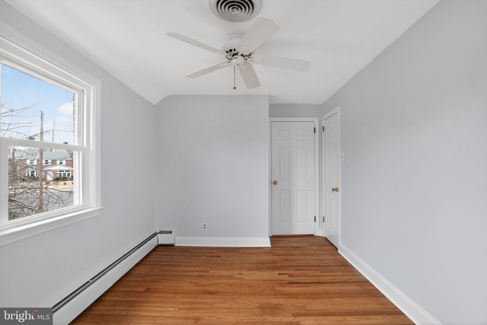 616 Hey Lane Springfield, PA 19064 - Photo 23 of 35 a view of a room with wooden floor and a ceiling fan