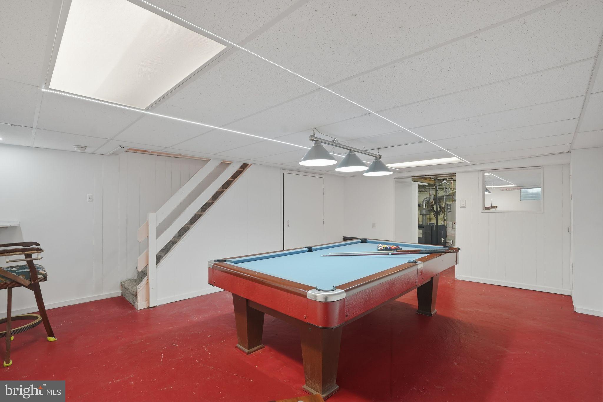 616 Hey Lane Springfield, PA 19064 - Photo 28 of 35 a room with pool table and wooden floor