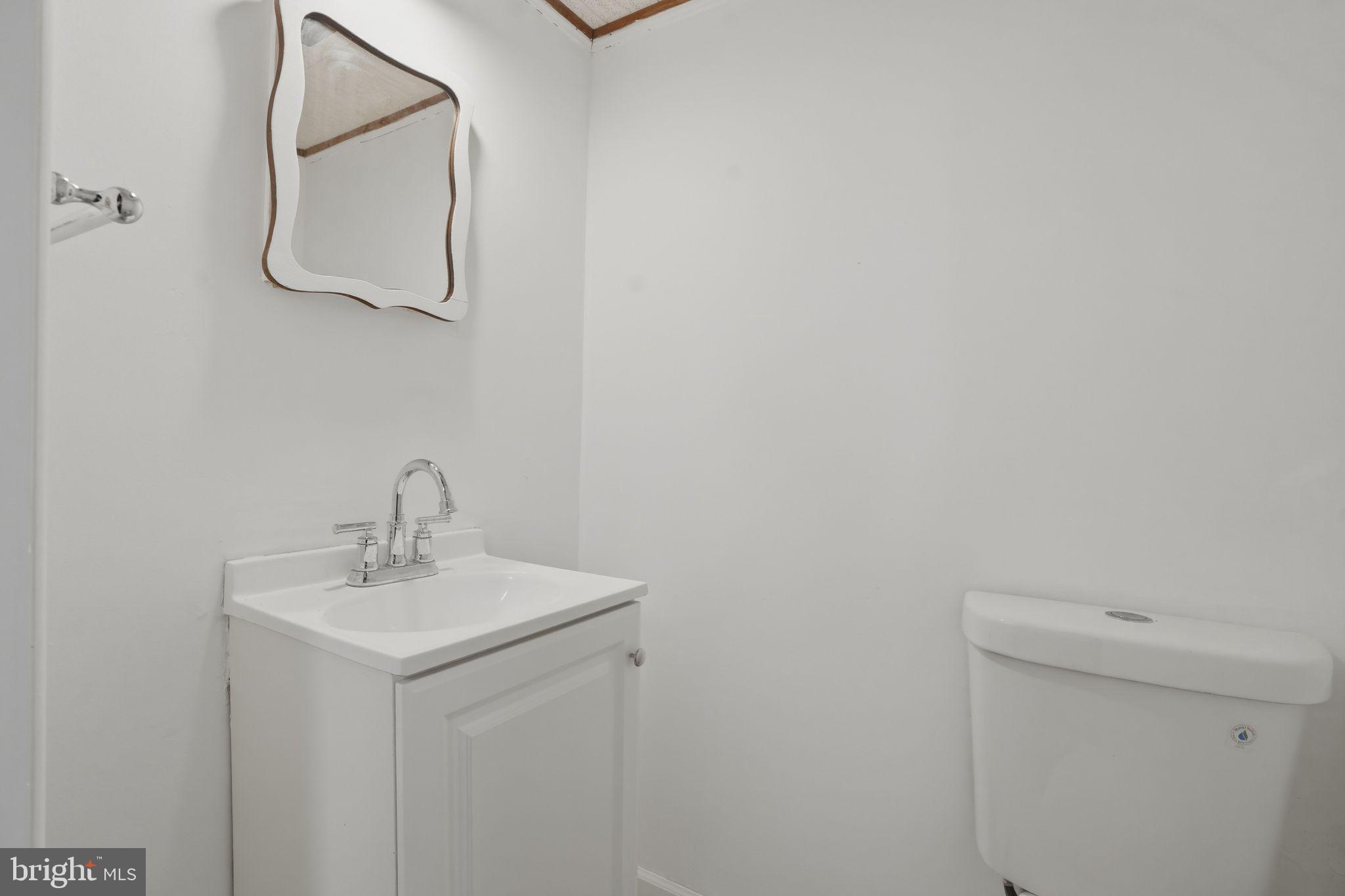 616 Hey Lane Springfield, PA 19064 - Photo 30 of 35 a bathroom with a sink and mirror