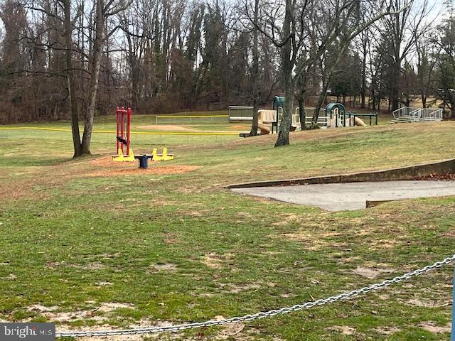 616 Hey Lane Springfield, PA 19064 - Photo 34 of 35 a view of a swimming pool with a yard and trees