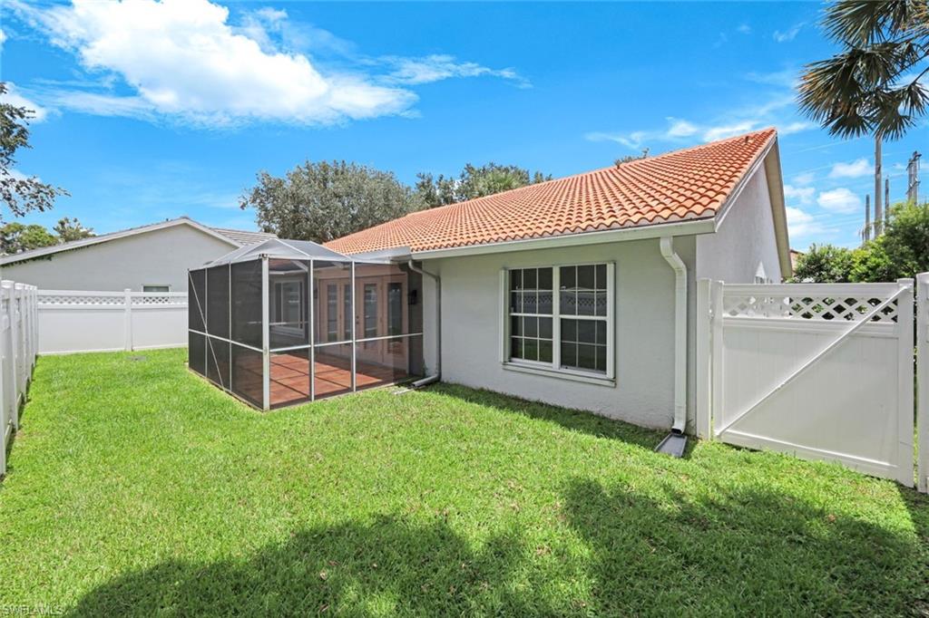 12800 Eagle Pointe Circle Fort Myers, FL 33913 - Photo 25 of 28 a view of a house with a backyard