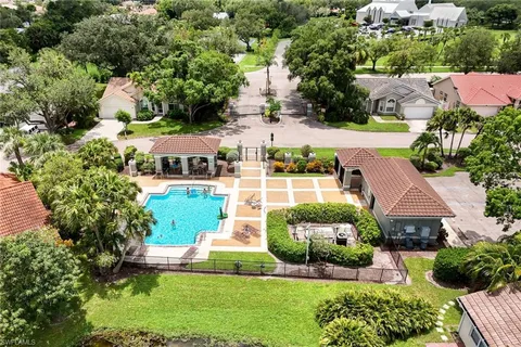 an aerial view of multiple houses with yard