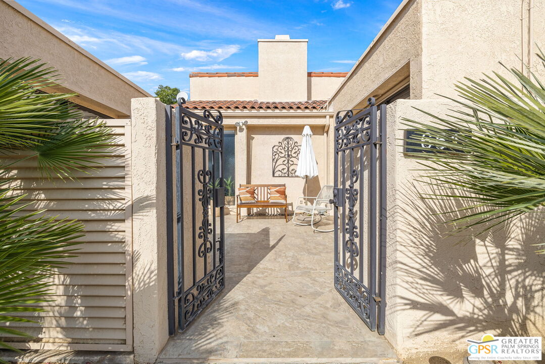 651 Hospitality Drive Rancho Mirage, CA 92270 - Photo 16 of 44 a view of a hallway with a outdoor space