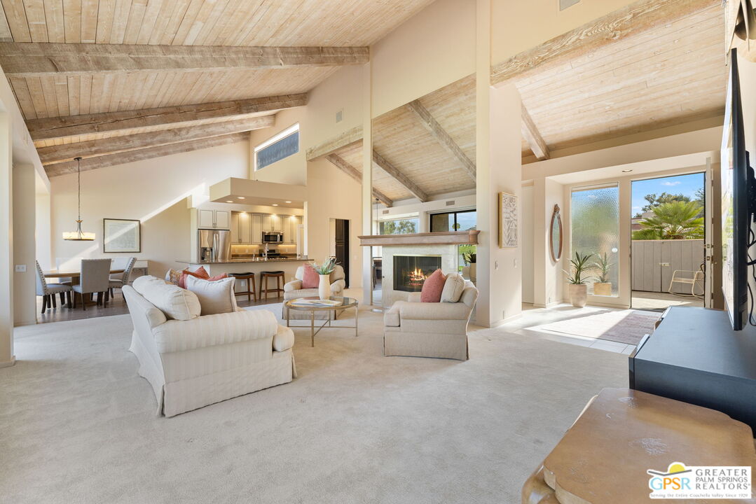 651 Hospitality Drive Rancho Mirage, CA 92270 - Photo 18 of 44 a living room with furniture and a large window