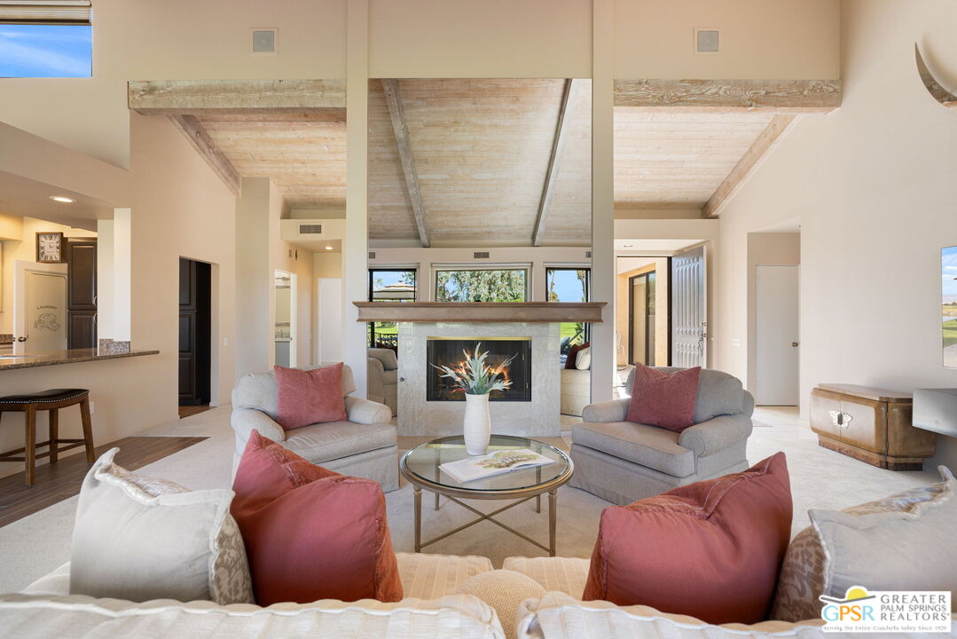 651 Hospitality Drive Rancho Mirage, CA 92270 - Photo 19 of 44 a living room with furniture and a fireplace