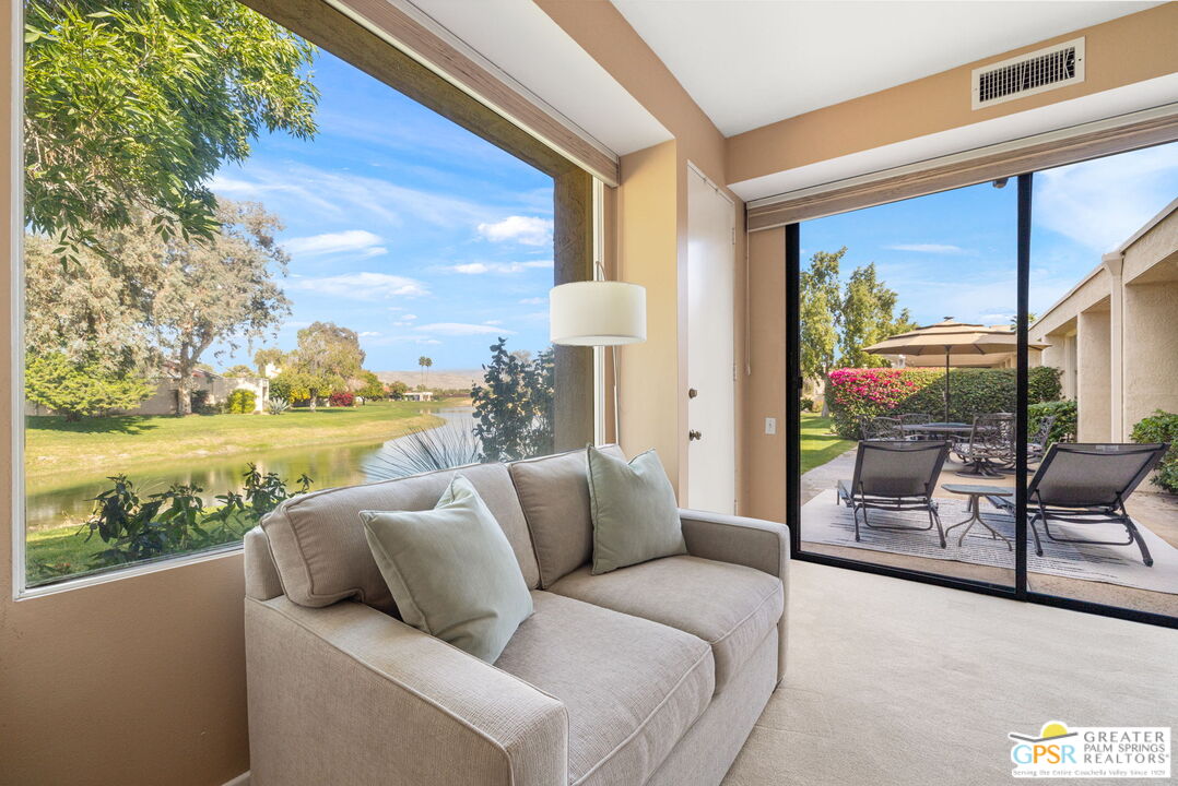 651 Hospitality Drive Rancho Mirage, CA 92270 - Photo 33 of 44 a balcony with furniture and a garden