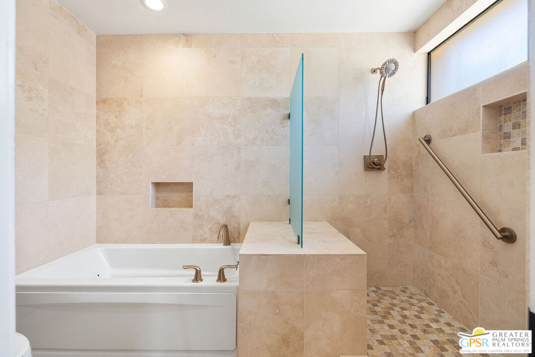 651 Hospitality Drive Rancho Mirage, CA 92270 - Photo 37 of 44 a bathroom with a bathtub and a sink