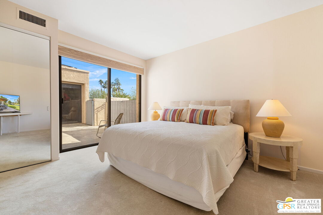 651 Hospitality Drive Rancho Mirage, CA 92270 - Photo 38 of 44 a bedroom with a bed and large window