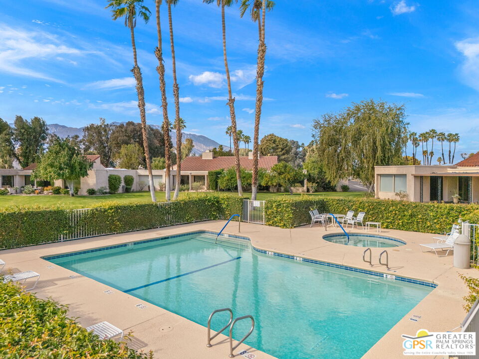 651 Hospitality Drive Rancho Mirage, CA 92270 - Photo 5 of 44 a view of a swimming pool with a yard