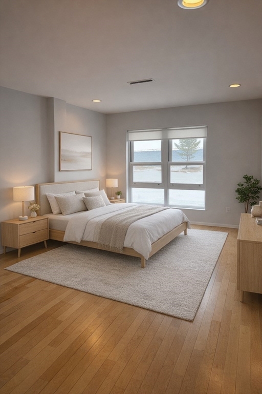 1 Seal Harbor Road, Unit 210 Winthrop, MA 02152 - Photo 7 of 27 a bedroom with a bed and a couch