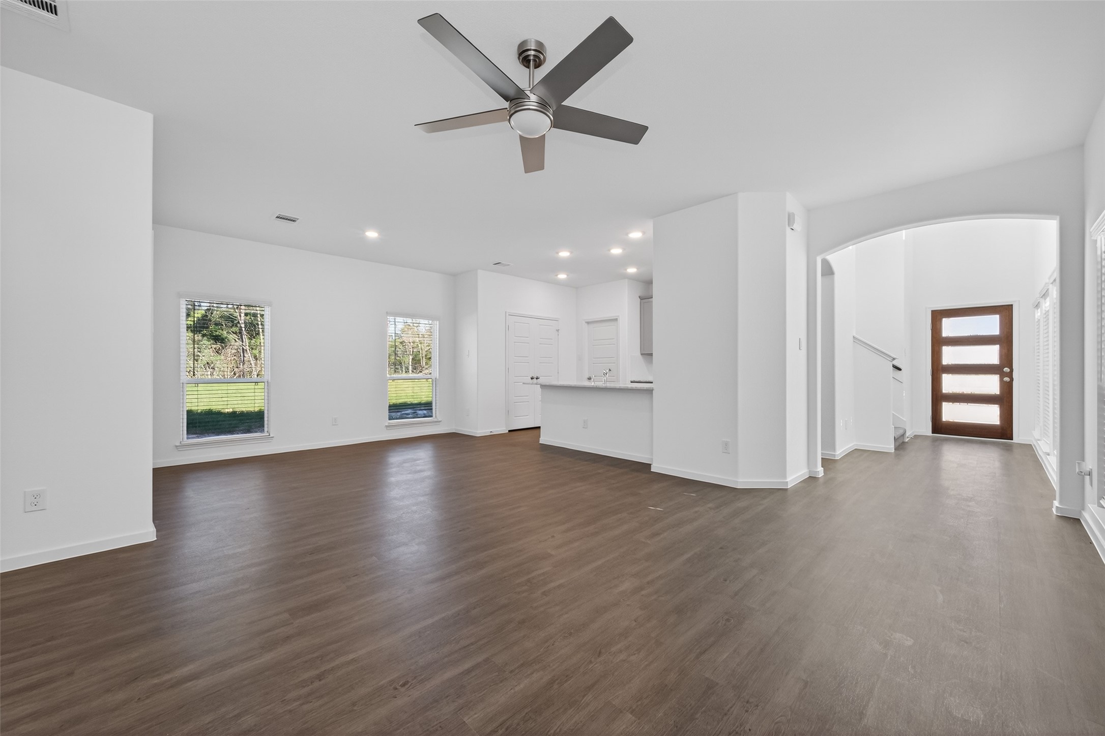 12375 Sunset Canyon Way Willis, TX 77318 - Photo 13 of 40 a view of an empty room with window and wooden floor