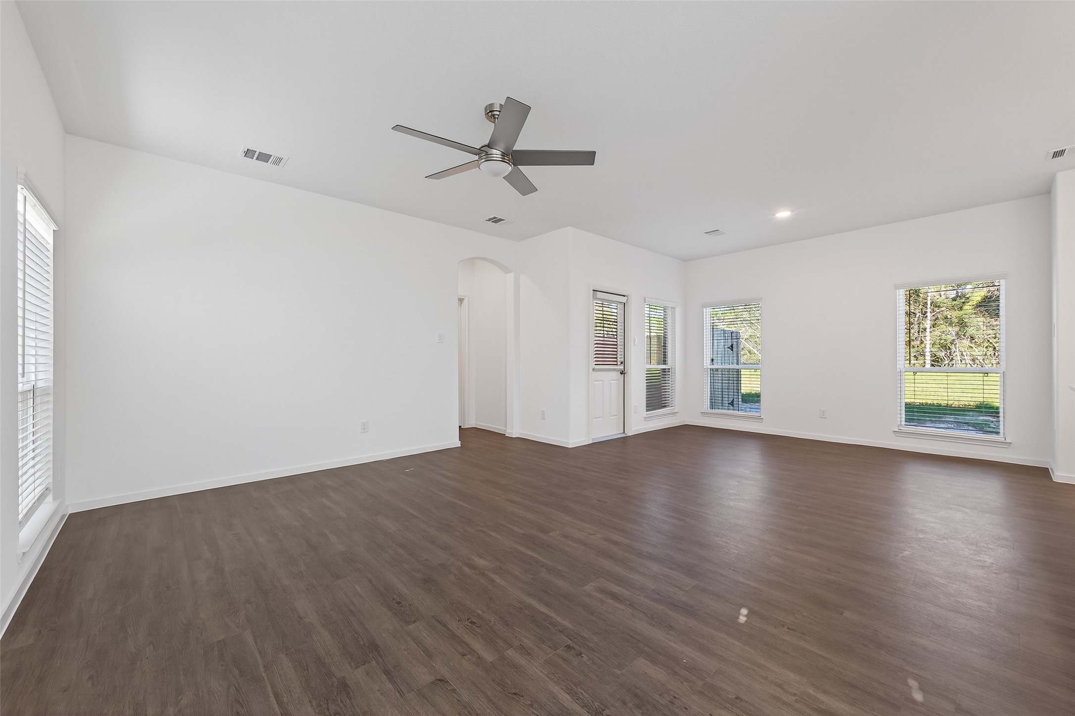12375 Sunset Canyon Way Willis, TX 77318 - Photo 14 of 40 wooden floor in an empty room with a window