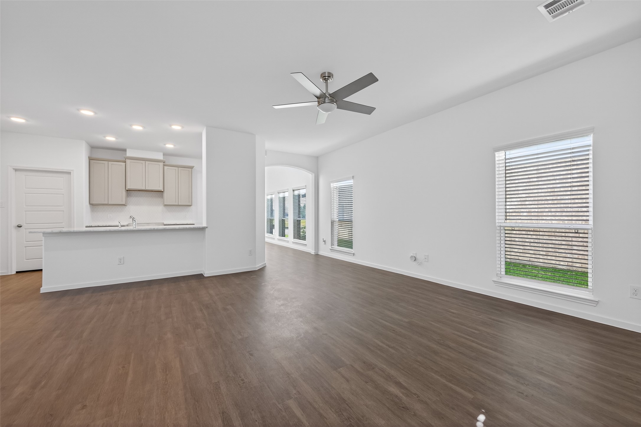 12375 Sunset Canyon Way Willis, TX 77318 - Photo 15 of 40 a view of an empty room with a window and wooden floor