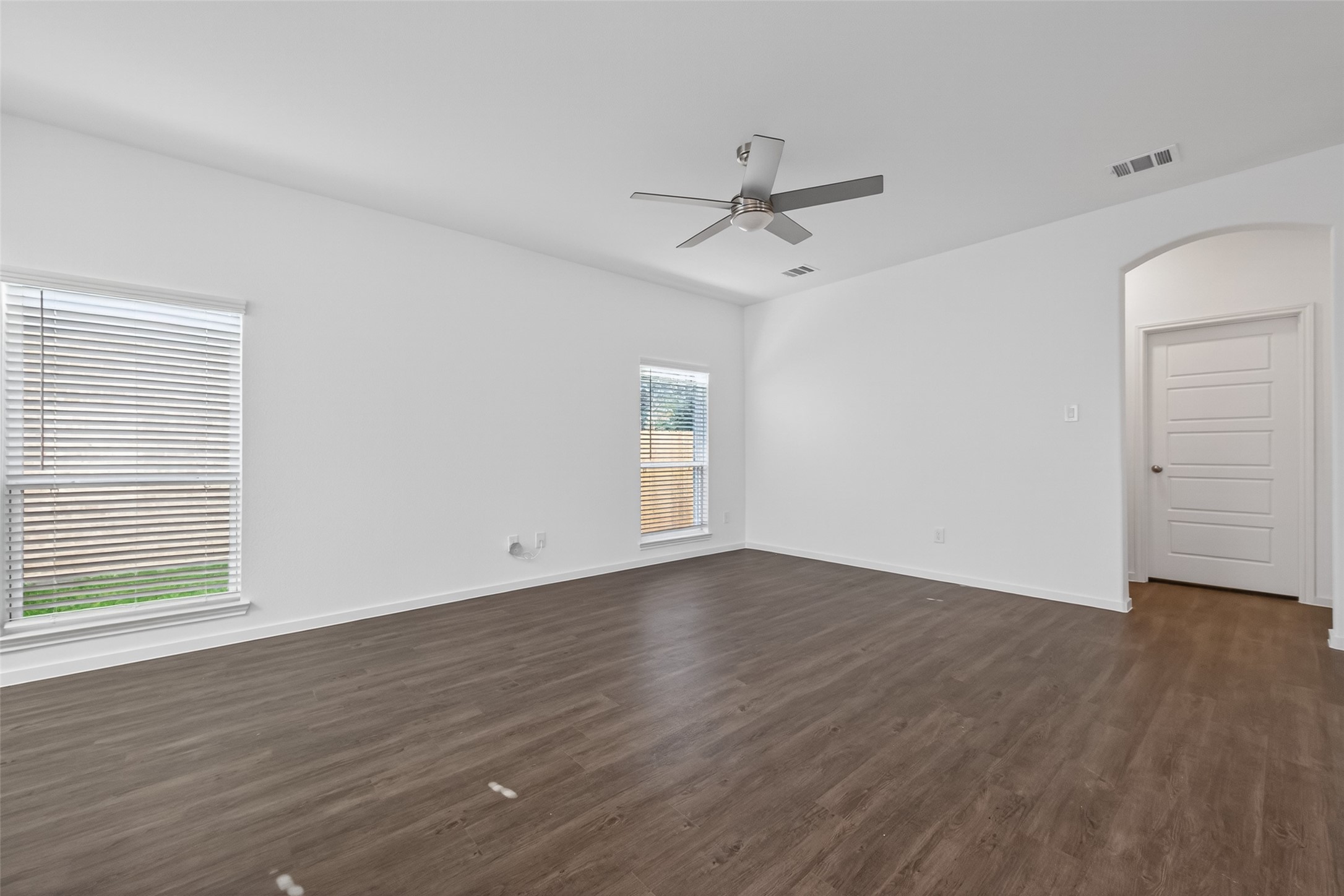 12375 Sunset Canyon Way Willis, TX 77318 - Photo 16 of 40 a view of an empty room with wooden floor and a window