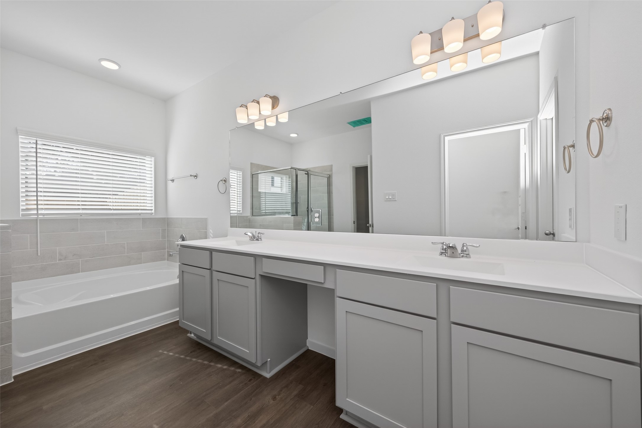 12375 Sunset Canyon Way Willis, TX 77318 - Photo 23 of 40 a bathroom with a sink double vanity granite tub and a mirror