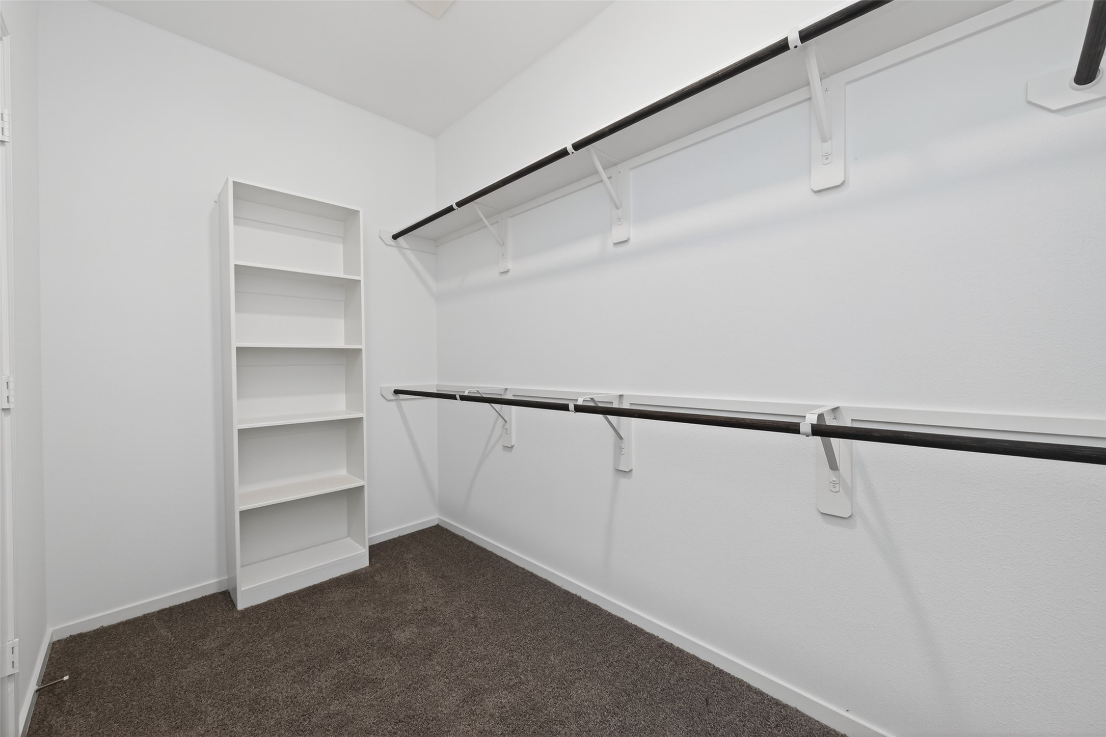 12375 Sunset Canyon Way Willis, TX 77318 - Photo 25 of 40 a view of an empty walk in closet