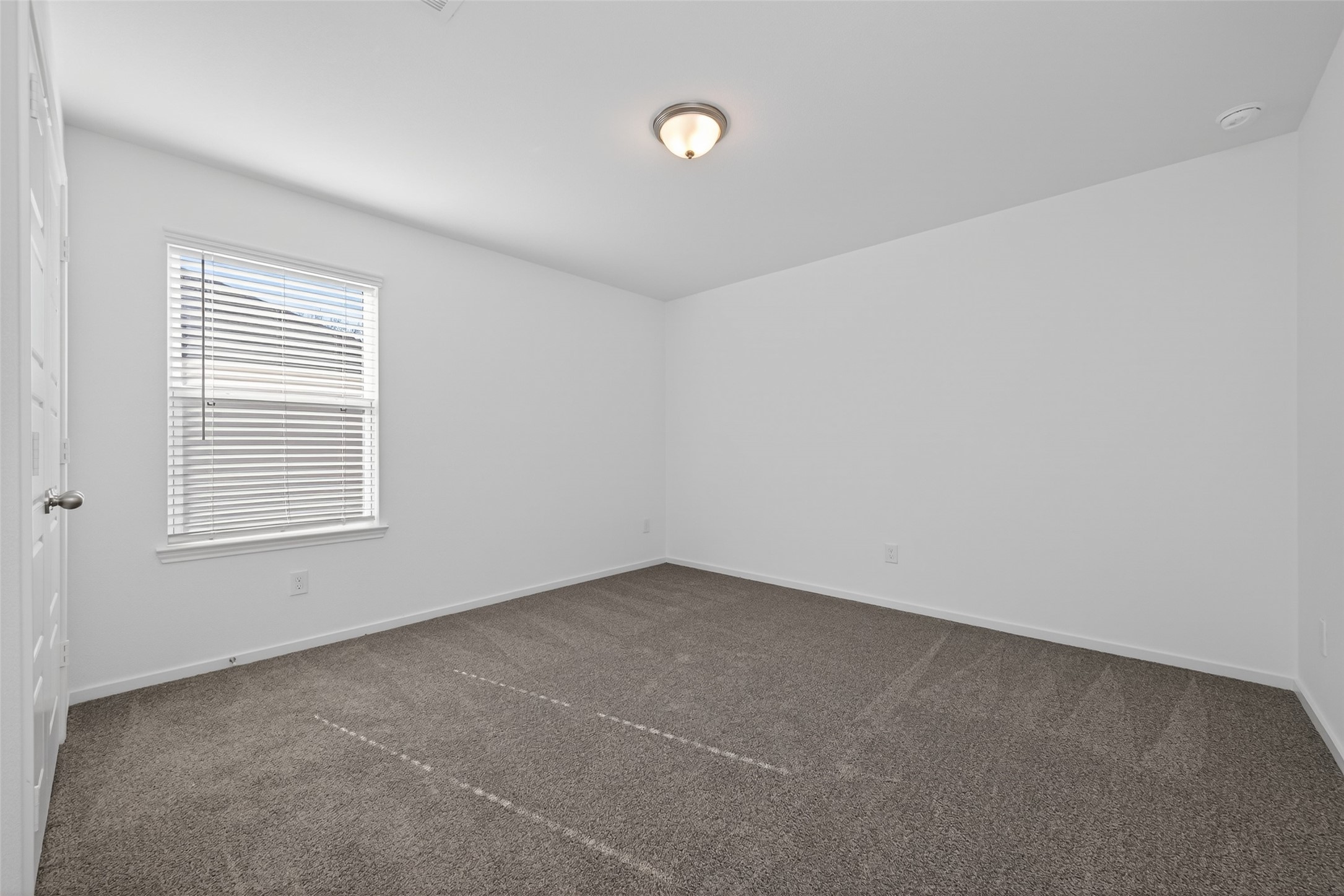 12375 Sunset Canyon Way Willis, TX 77318 - Photo 31 of 40 an empty room with a window