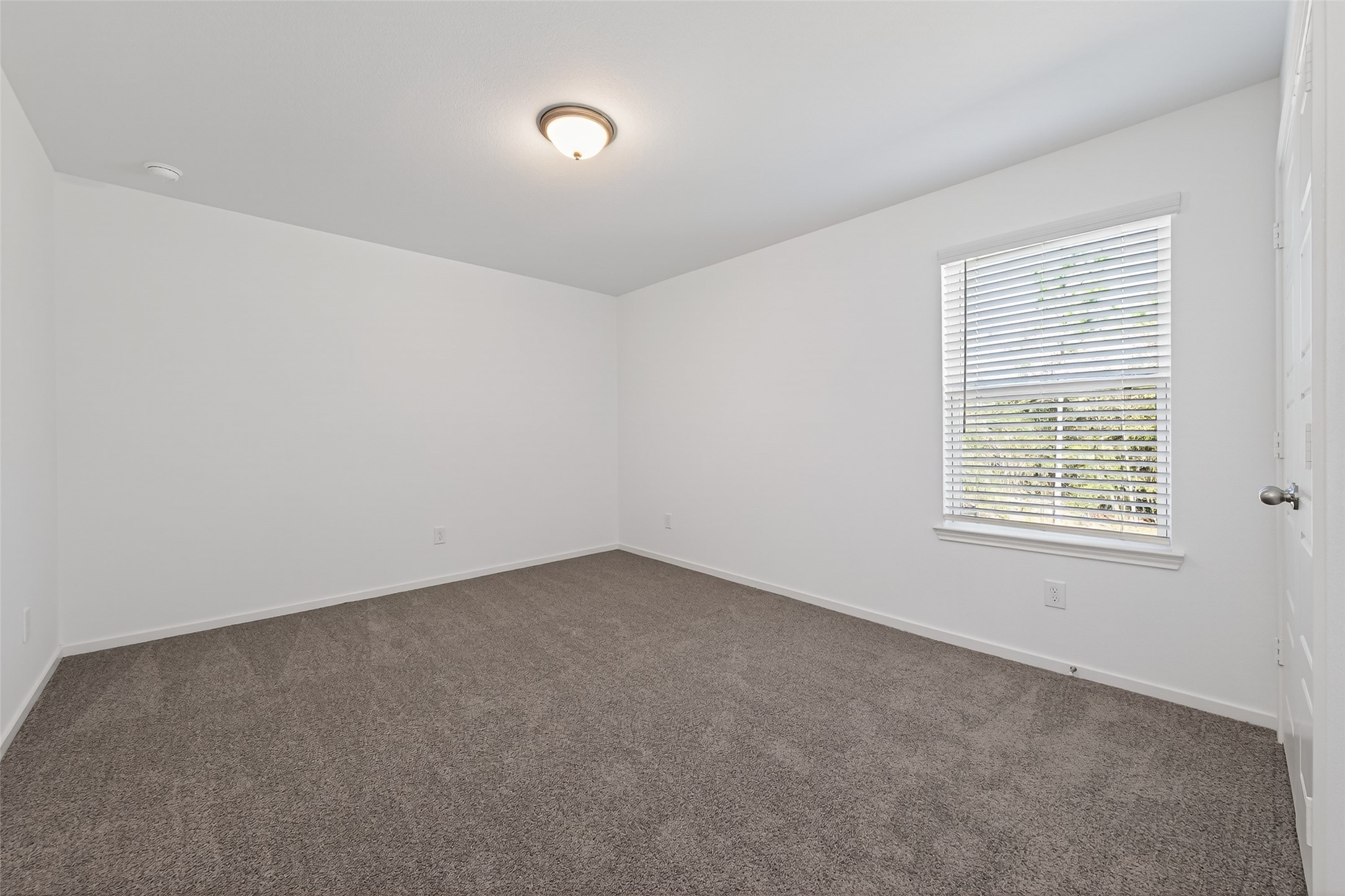 12375 Sunset Canyon Way Willis, TX 77318 - Photo 33 of 40 an empty room with a window