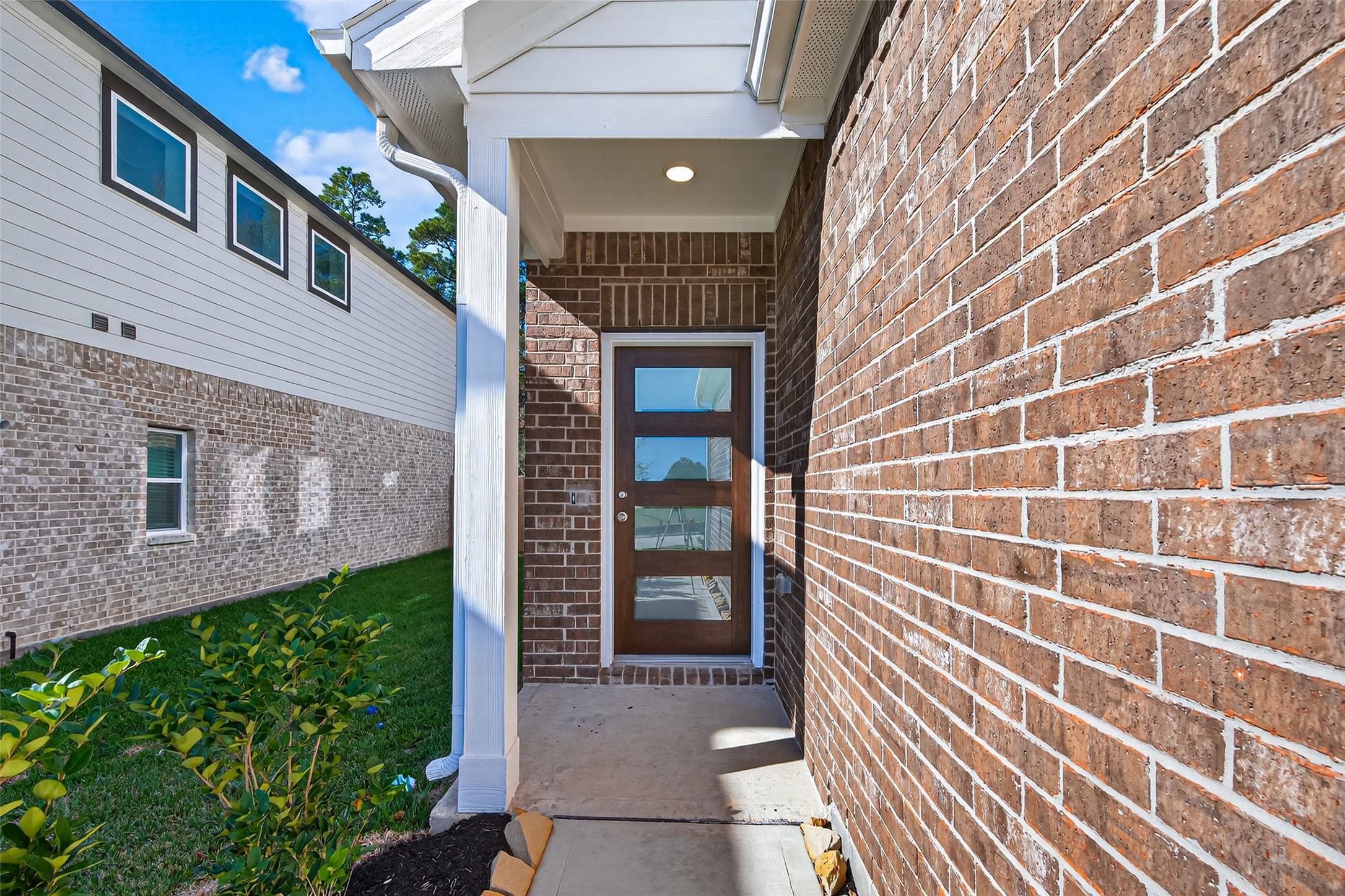 12375 Sunset Canyon Way Willis, TX 77318 - Photo 4 of 40 a view of a brick house with a large window