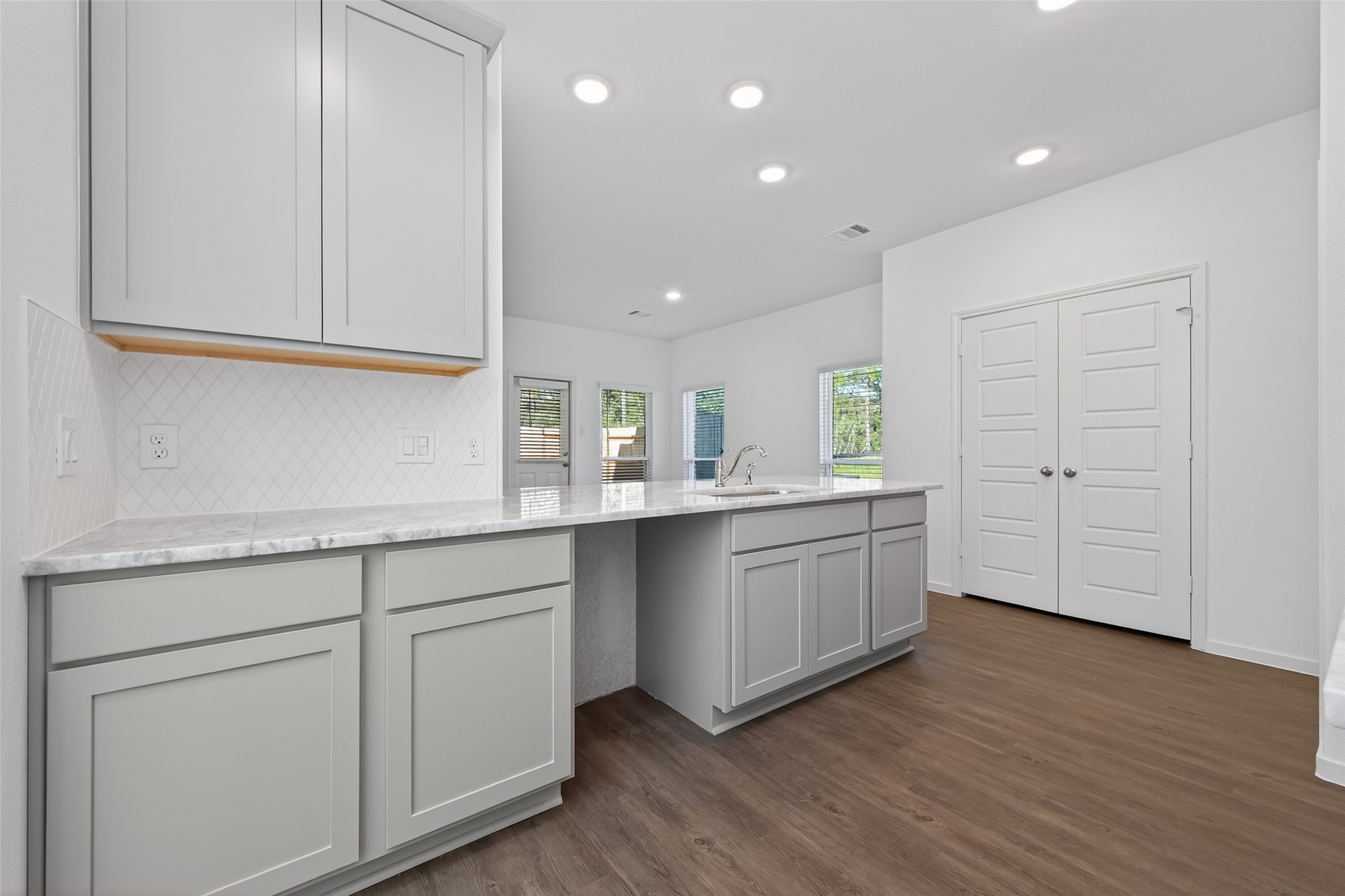 12375 Sunset Canyon Way Willis, TX 77318 - Photo 7 of 40 a kitchen with sink and cabinets