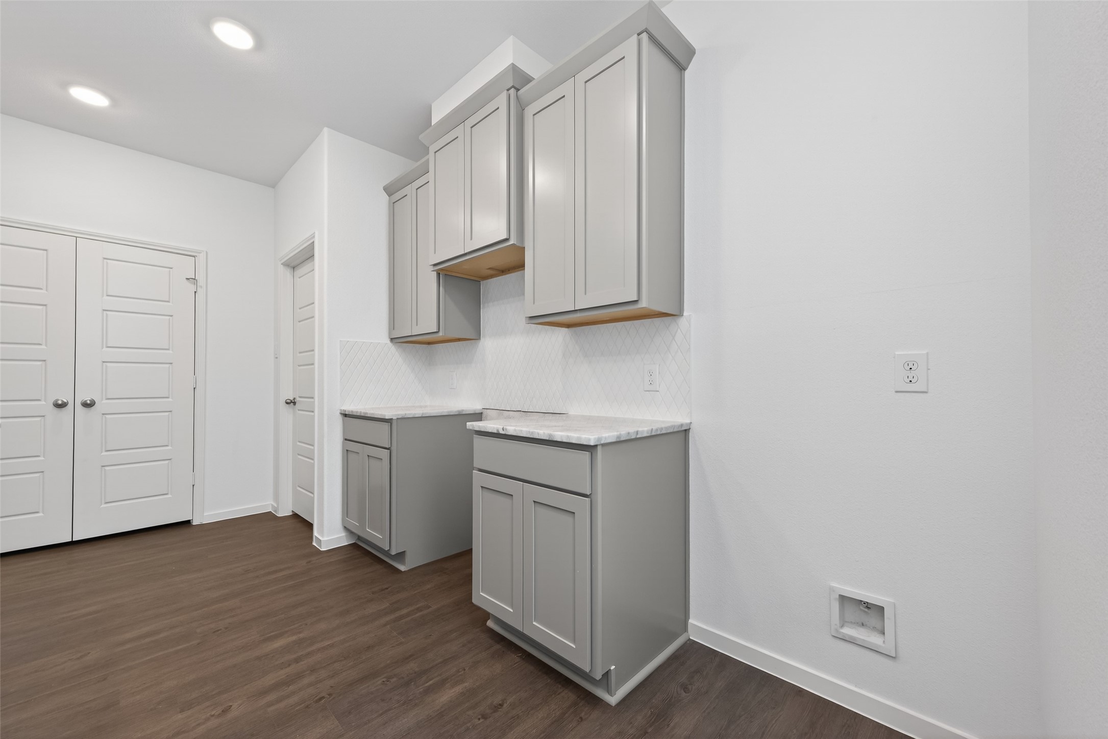 12375 Sunset Canyon Way Willis, TX 77318 - Photo 9 of 40 a kitchen with white cabinets and sink