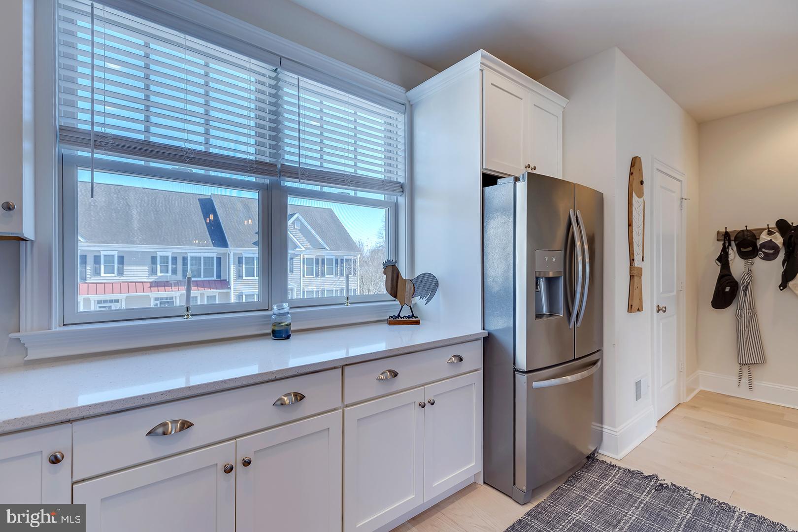18799 Bethpage Drive, Unit 16E Lewes, DE 19958 - Photo 17 of 68 a kitchen with stainless steel appliances a refrigerator and a sink