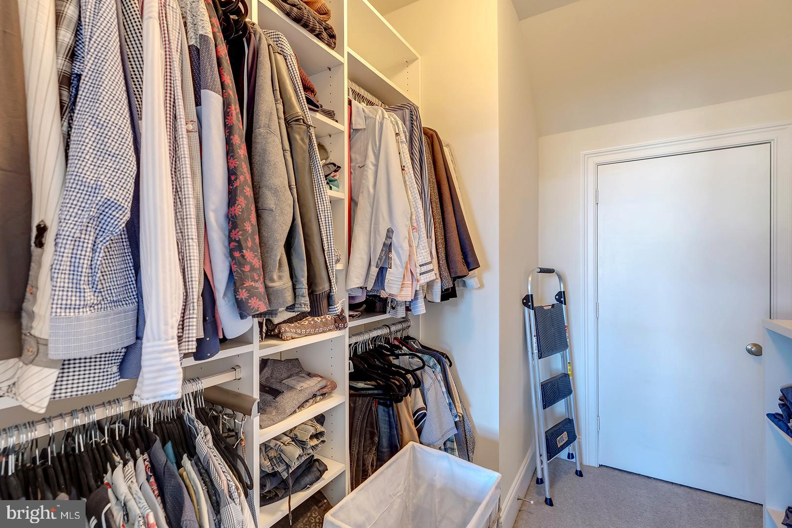 18799 Bethpage Drive, Unit 16E Lewes, DE 19958 - Photo 21 of 68 a view of walk in closet with clothes and shoes