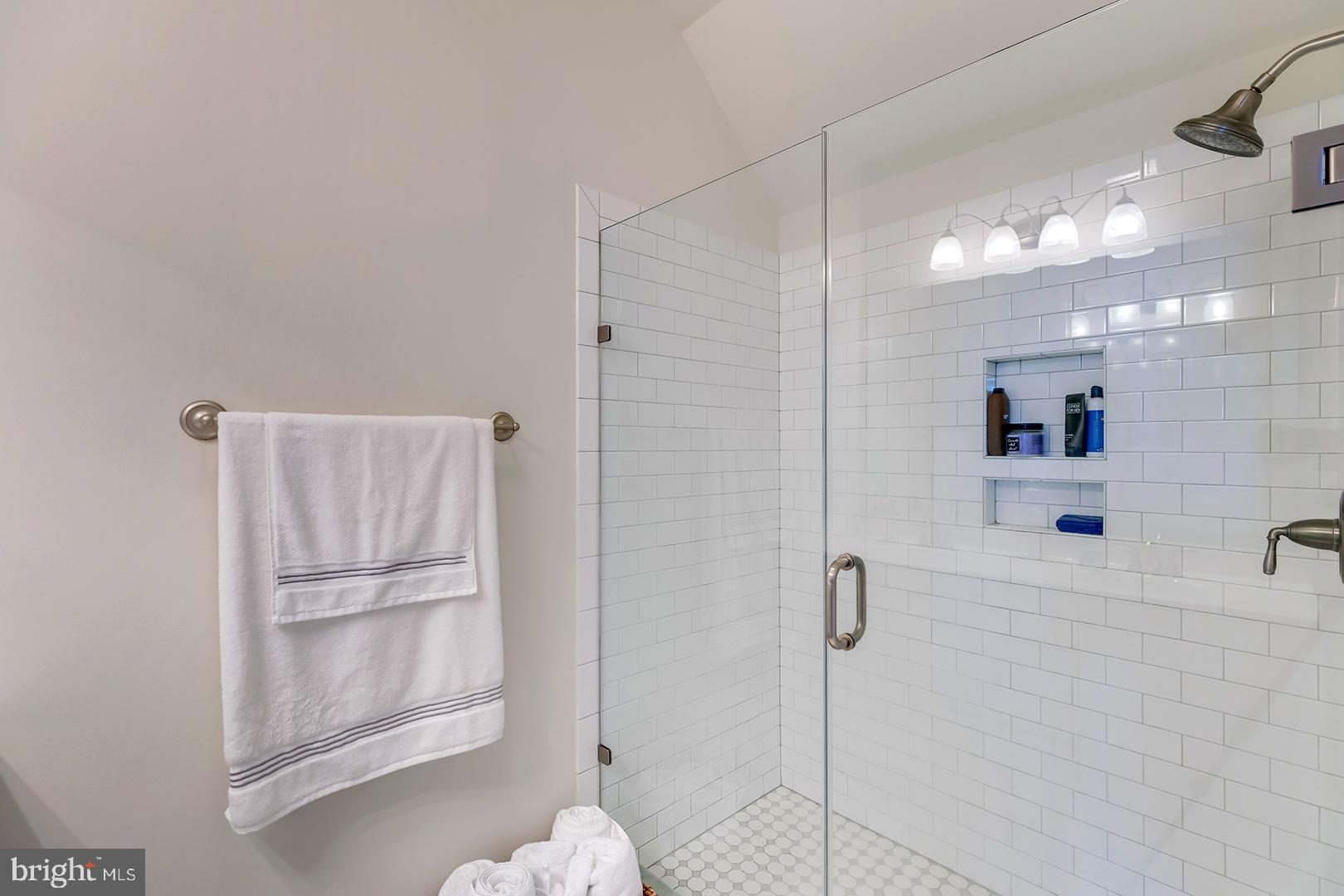 18799 Bethpage Drive, Unit 16E Lewes, DE 19958 - Photo 23 of 68 a bathroom with a shower