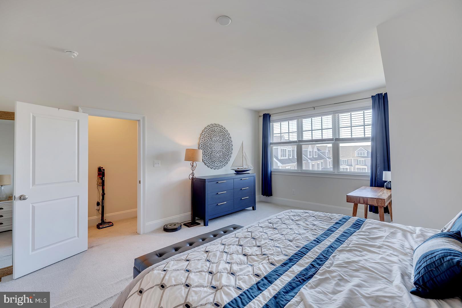 18799 Bethpage Drive, Unit 16E Lewes, DE 19958 - Photo 24 of 68 a bedroom with a bed and a window