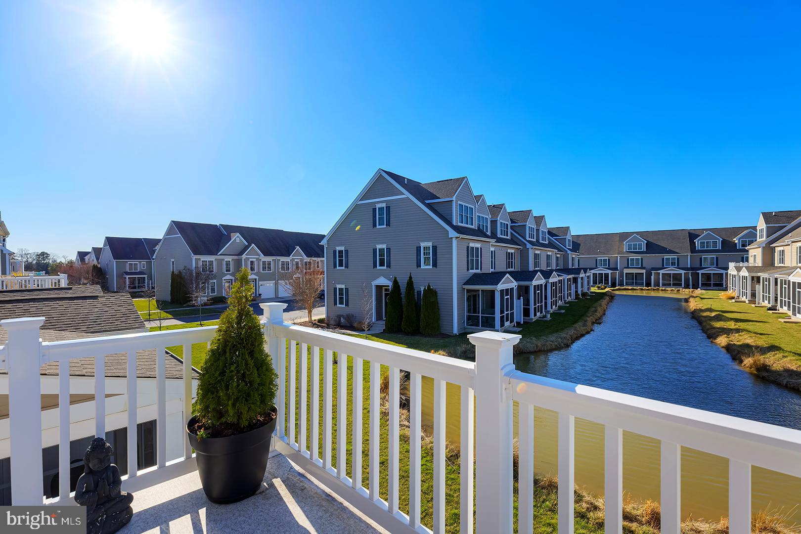 18799 Bethpage Drive, Unit 16E Lewes, DE 19958 - Photo 44 of 68 a view of a houses with a city from a balcony