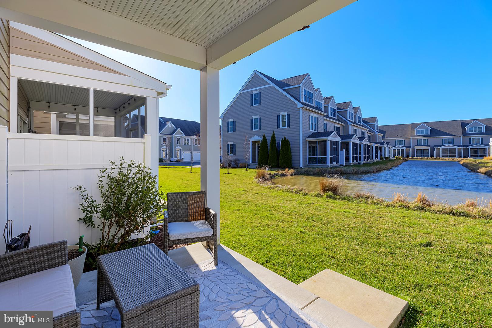 18799 Bethpage Drive, Unit 16E Lewes, DE 19958 - Photo 45 of 68 a view of a swimming pool with a lounge chairs
