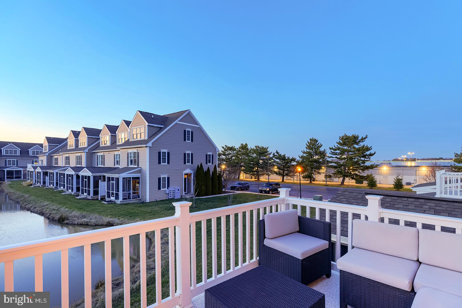 18799 Bethpage Drive, Unit 16E Lewes, DE 19958 - Photo 49 of 68 a view of a chairs and table on the wooden floor