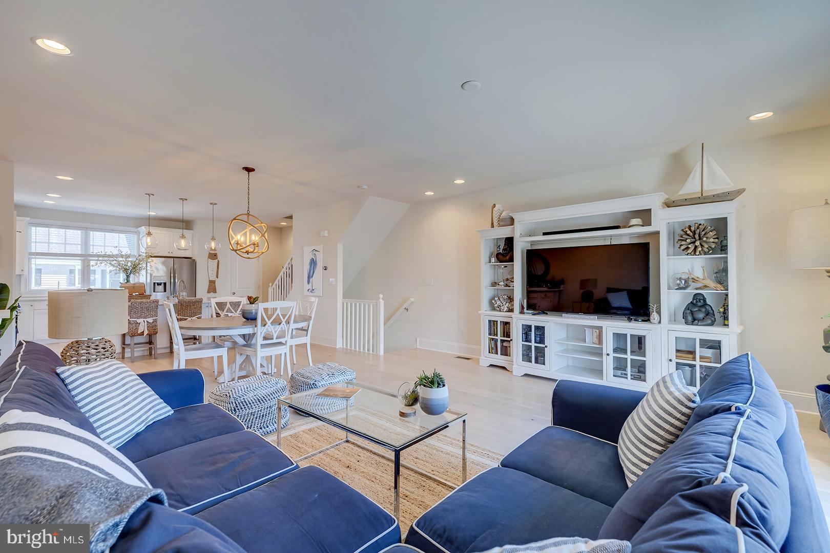 18799 Bethpage Drive, Unit 16E Lewes, DE 19958 - Photo 5 of 68 a living room with furniture and a flat screen tv
