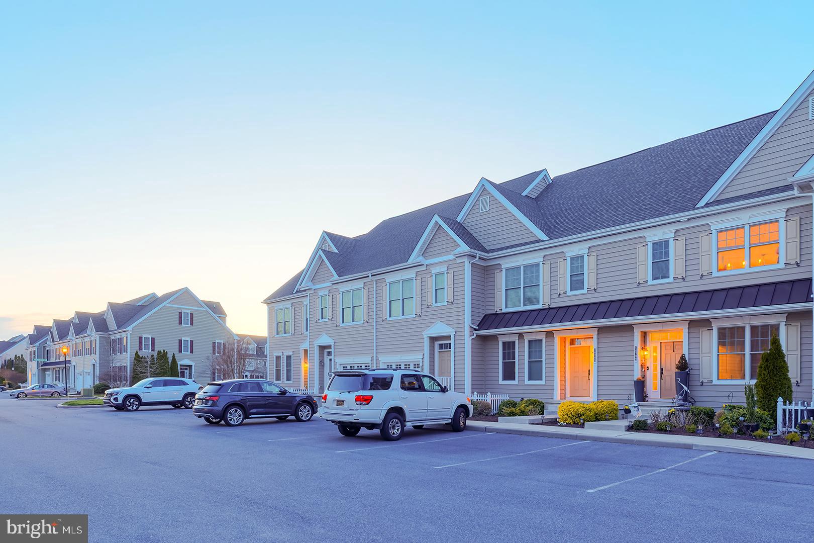 18799 Bethpage Drive, Unit 16E Lewes, DE 19958 - Photo 57 of 68 a car parked in front of a building